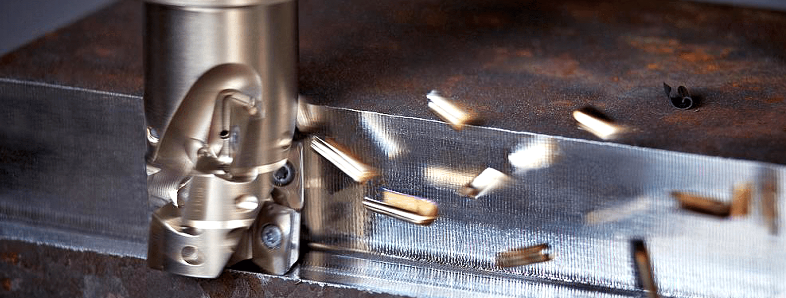 A machine cutting metal with many pieces of metal.
